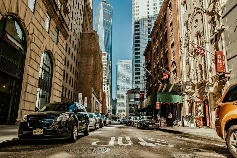Parked cars in a narrow Manhattan street | NY City Limo