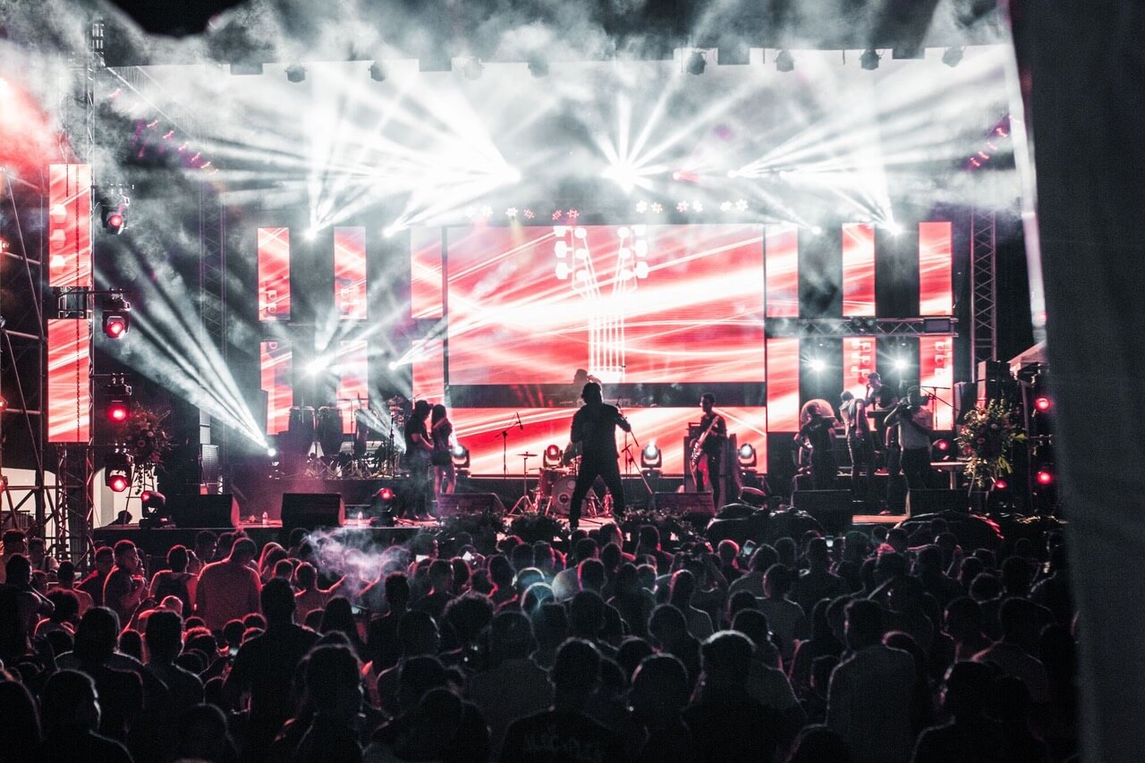 Concert crowd at a lit stage before a night out with NYC car service