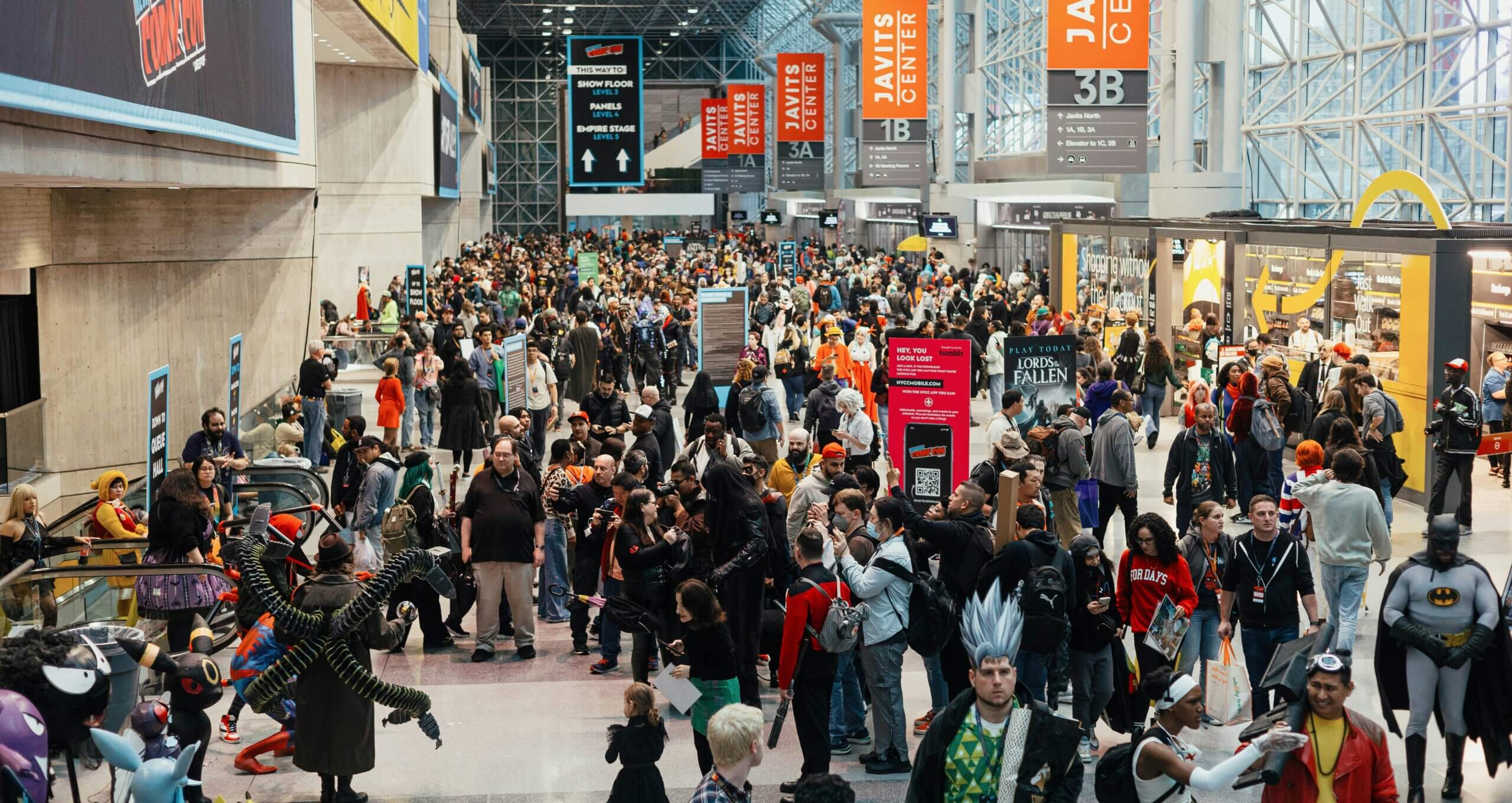 Crowds pack the concourse on a busy trade show day, where Javits Center transportation skips the long rideshare lines.