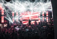 Concert crowd at a lit stage before a night out with NYC car service
