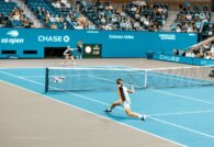 US Open tennis match on blue hard court at Arthur Ashe
